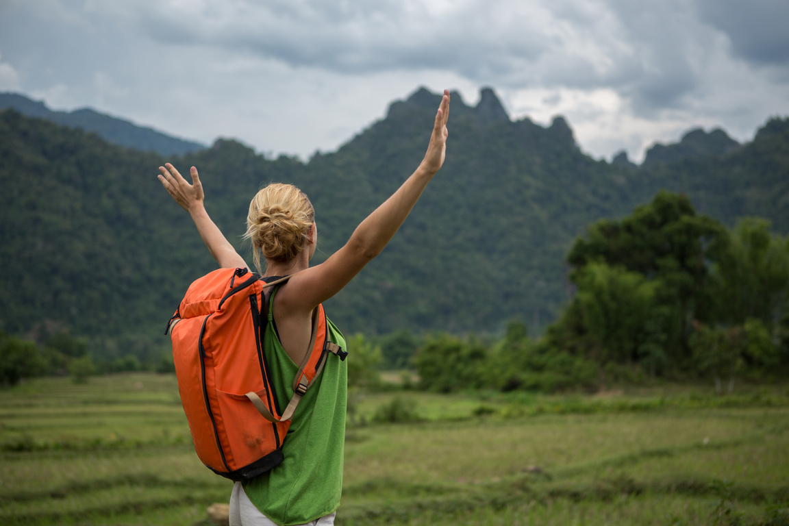 Woman on eco-tourism hiking experience, success